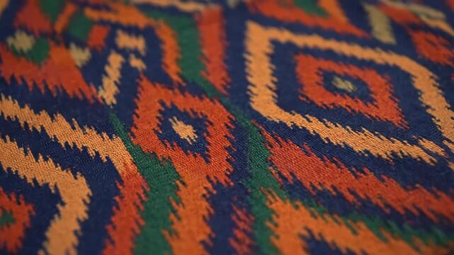 Geometric Ikat Motif Fabric - Close-up of a colorful woven fabric featuring a seamless geometric ikat motif with bohemian flair and ethnic-inspired design.