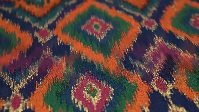 Colorful Bohemian Ikat Fabric Detail - This close-up shot showcases a seamless geometric ikat motif with a Bohemian flair. The fabric features colorful ethnic-inspired patterns and glittering accents.