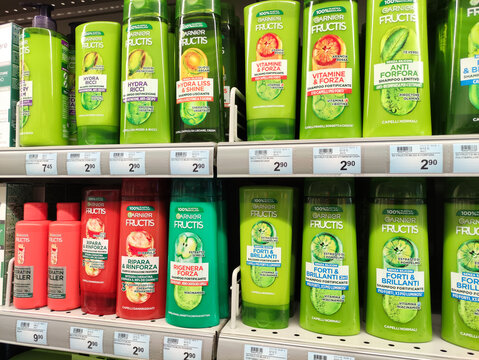 Gualdo Tadino, Italy - October 21, 2025: Garnier Fructis hair care products displayed on supermarket shelves, showcasing vibrant packaging and various formulas for different hair types