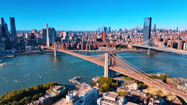 Two famous bridges of New York, USA on sunny day. View on Manhattan from Brooklyn side. Aerial perspective.