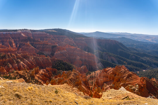 Cedar Breaks National Monument in Utah. A natural amphitheater filled with hoodoos, windows, canyons, spires, walls, and steep cliffs. A veiw from the canyon rim. Brian Head Peak in distance. 
