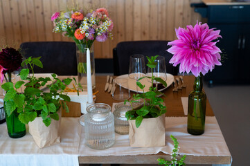 Elegant Wedding Reception Hall with Floral and Green Table Decorations