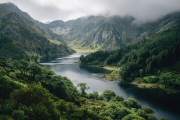 Serene mountain landscape with tranquil lake surrounded by greenery and misty peaks, evoking a peaceful and mysterious atmosphere for nature lovers and adventure seekers