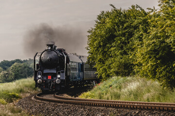 Classic steam locomotive moving. History and power on the rails.