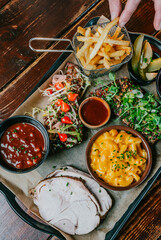 A tray of food with a variety of dishes including mac and cheese