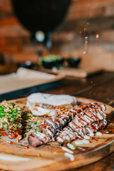 A plate of food with a piece of meat on it