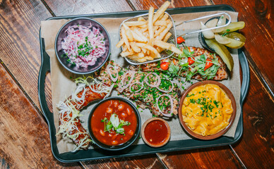 A tray of food with a variety of dishes including macaroni and cheese