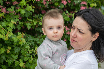 Middle aged mother and her infant daughter