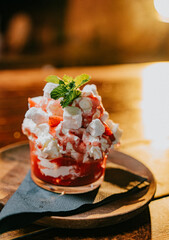 A dessert with strawberries and whipped cream on top