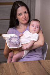 Mother and daughter baby with birthday cake