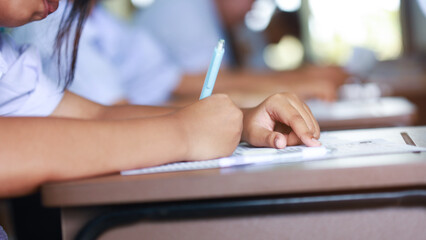 The students were doing the exams inside the classroom with stress.Assessment examination of high school students