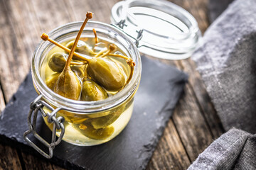 Pickled capers berries in jar.