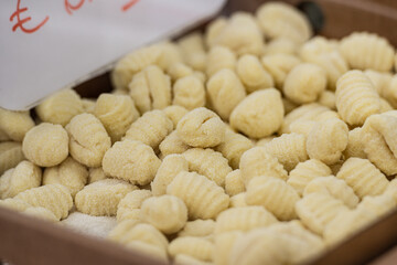 Fresh homemade gnocchi for sale in a street food market