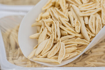 Fresh homemade cavatelli capunti for sale in a street food market