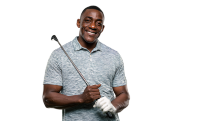 a black man holding a golf club, smiling and posing for a photograph, isolated on a transparent background