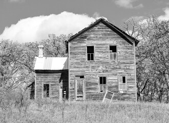 Abandoned weathered wood farmhouse