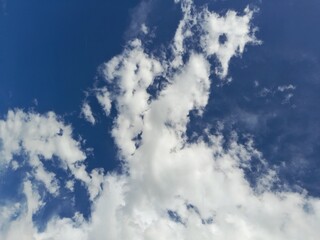 Contrast of Deep Blue with White Clouds