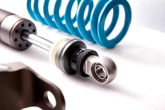 Racing Shock Absorber with Coil Spring on White Background