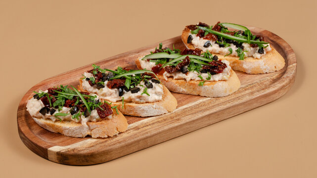 Italian bruschetta on wooden tray isolated