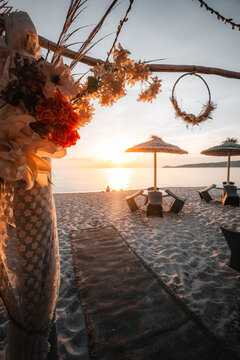 sunset on the beach with flowers