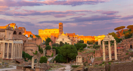 Roman Forum with the Colosseum in the background at sunrise in Rome, Italy