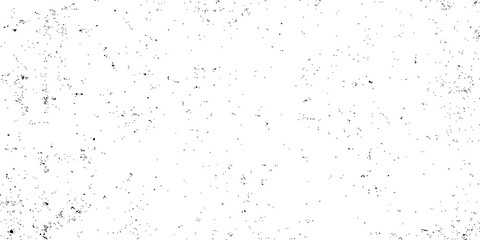 Old, dirty, black and white textured grunge paint splashes on a paper or wall surface for a vintage art design backdrop