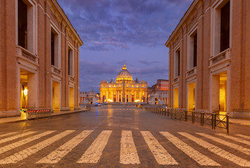 View of Saint Peter Basilica and Via della Conciliazione at dawn in Rome, Italy