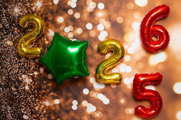 golden sign saying 2025 and 2026 with bokeh background