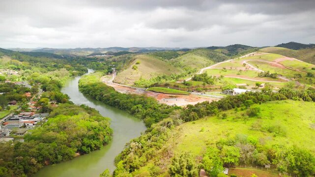 aerial view of Guararema town in the countryside of Sao Paulo state in Brazil with green and astonishing forest with Paraiba do Sul river