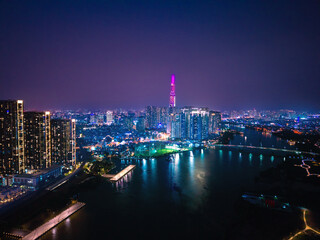 Saigon or Ho chi minh city in Vietnam Aerial view, neon illuminated of skyscrapers with night stars