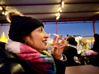 Woman enjoying white wine at budapest rooftop bar