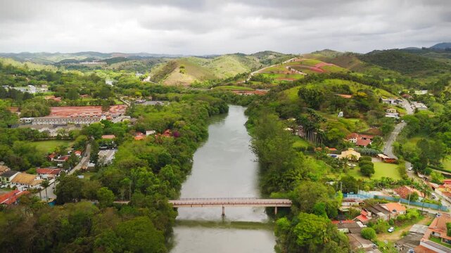 aerial view of Guararema town in the countryside of Sao Paulo state in Brazil with green and astonishing forest with Paraiba do Sul river