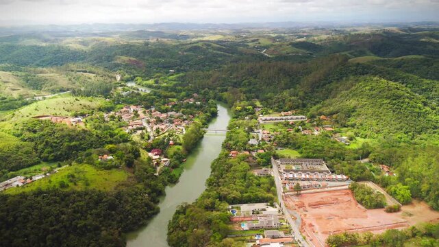 aerial view of Guararema town in the countryside of Sao Paulo state in Brazil with green and astonishing forest with Paraiba do Sul river