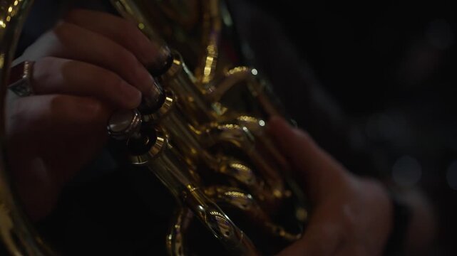 Close-Up of Trumpet Player&rsquo;s Fingers During Concert Rehearsal