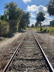 Fototapeta premium “Endless Train Tracks Leading Forward — Symbol of Travel and Freedom”