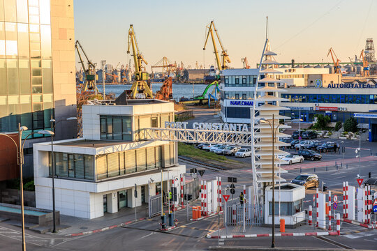 Port of constanta at sunset featuring cranes and modern architecture. May 3, 2025 Constanta Romania
