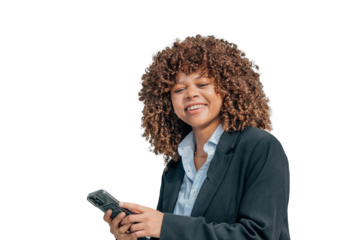 young businesswoman with afro hair and a mobile phone smiling on the street