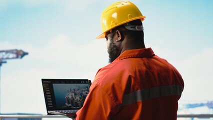 Fossil fuel company expert using laptop software to determine optimal drilling rig locations....