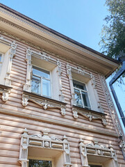 Ornate Slavic Wooden House in Vologda, Beige Facade with Carved Handmade Details