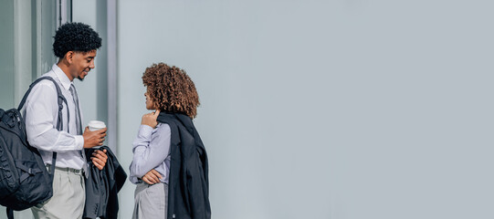 business people talking and drinking coffee during a break