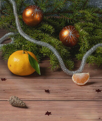 A New Year's still life with green branches, toys, a tangerine, and a pine cone. Postcard