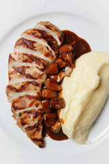 Grilled Chicken Breast with Mashed Potatoes and Savory Sauce