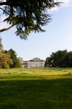 Villa Manin in Passariano, Codroipo, Friuli Venezia Giulia. View from inner park with centuries-old cedars and green lawn. 18th century Venetian architecture. Historic aristocratic atmosphere.