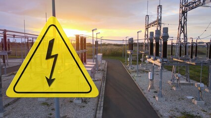 High voltage danger sign on a power distribution station, sunset. Graphic