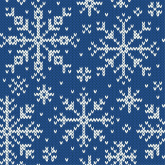 Fototapeta premium Snowflakes jacquard seamless pattern. Blue and white knitted background. Northern winter style. Vector illustration.