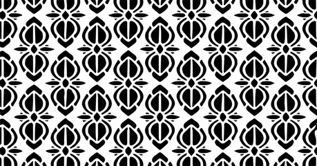 Bold black and white ornamental seamless pattern with symmetrical abstract motifs, modern and elegant background.