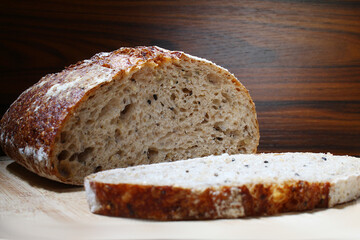 Whote wheat bread on the cutting board. Brazilian breakfast.