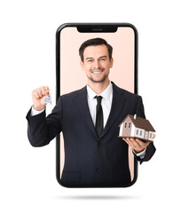 Male real estate agent with key and model of house on color background