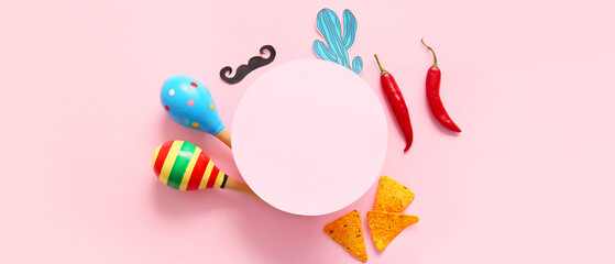 Fototapeta premium Composition with blank card, Mexican maracas, nachos chili peppers on pink background. El Dia de Muertos