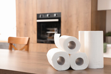 Rolls of paper towels on table in kitchen